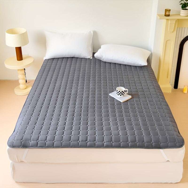 Waterproof mattress topper with machine washable quilted polyester cover, polyurethane liner, and non-slip design for dormitory and home use. 1-piece.