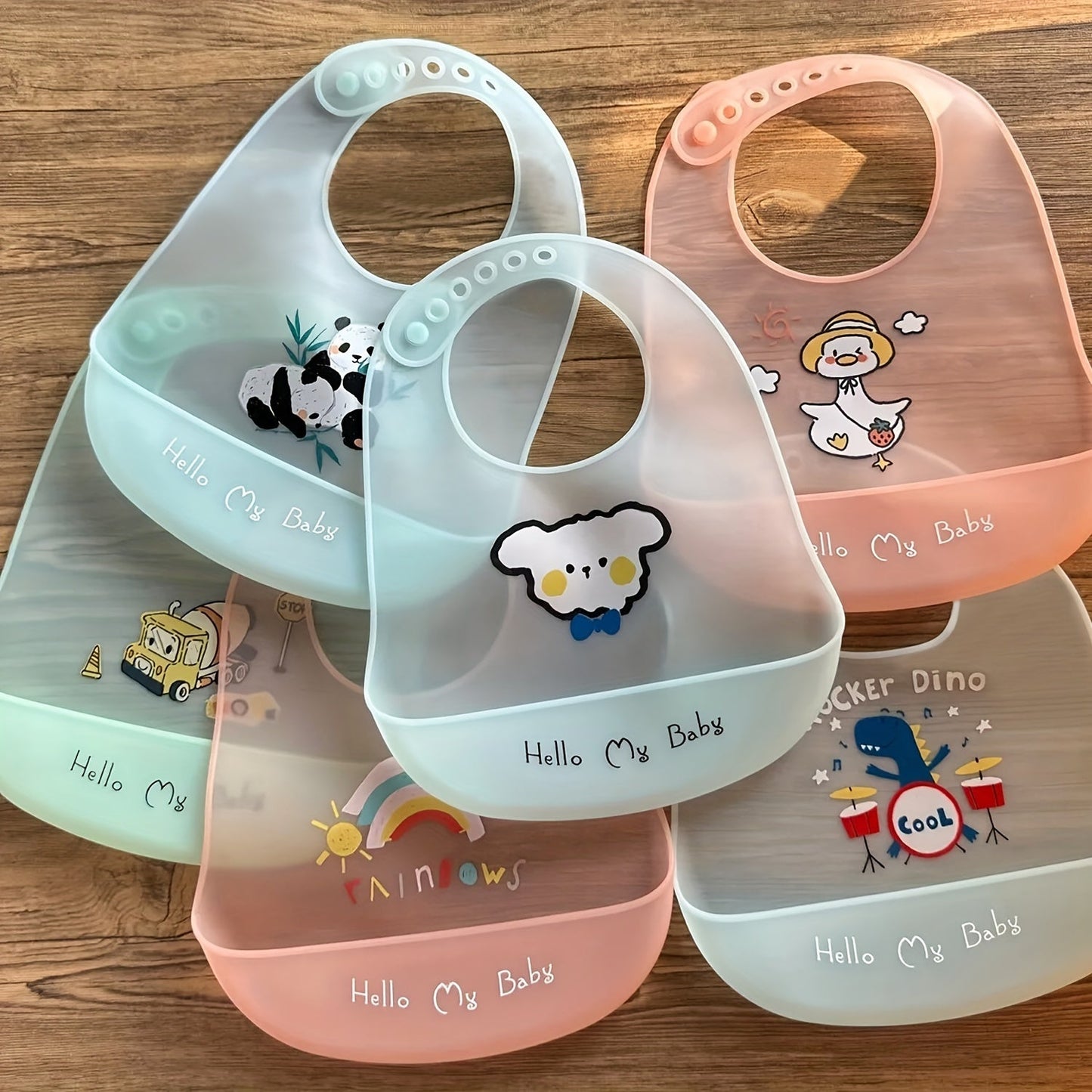 Soft and durable feeding bibs with adjustable neck band for cute babies, waterproof and adorable.