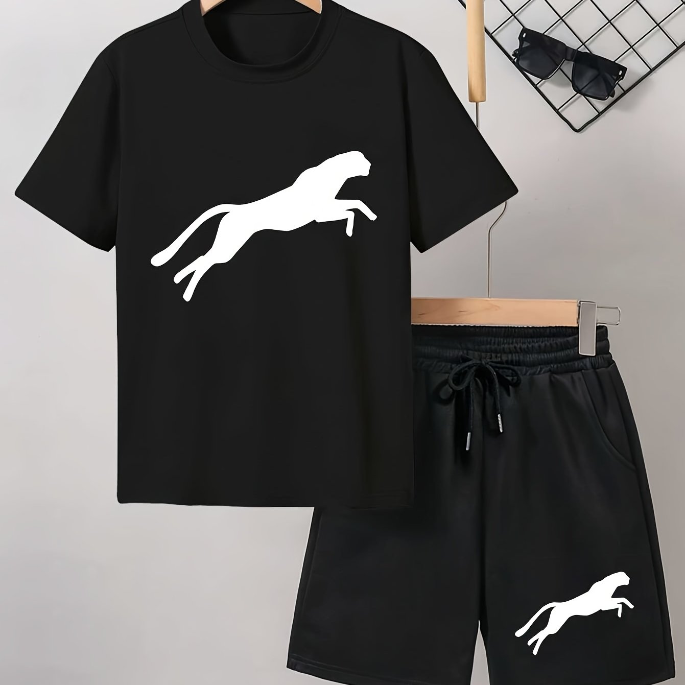 Men's casual Leopard Print Tee and Shorts Set in Light Gray with a Black Leopard silhouette on the t-shirt and White Leopard design on the black shorts. Made of a polyester blend for a