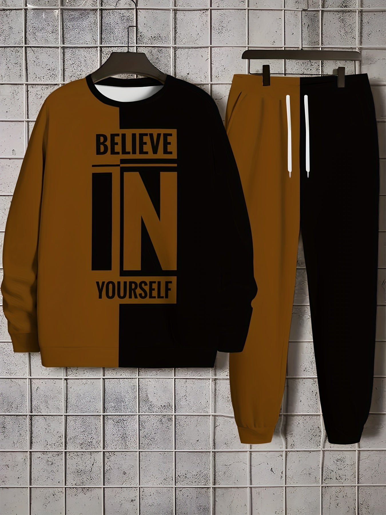 Men's polyester knit tracksuit featuring a crew neck long sleeve sweatshirt and joggers with "BELIEVE IN YOURSELF" print, offering a comfortable slight stretch in a two-piece outfit.