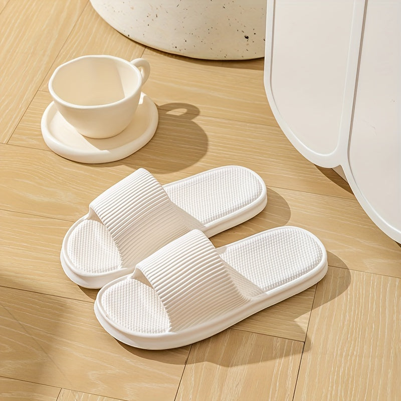 Gender-neutral EVA pillow slides with solid color, lightweight soft sole for home and beach comfort.