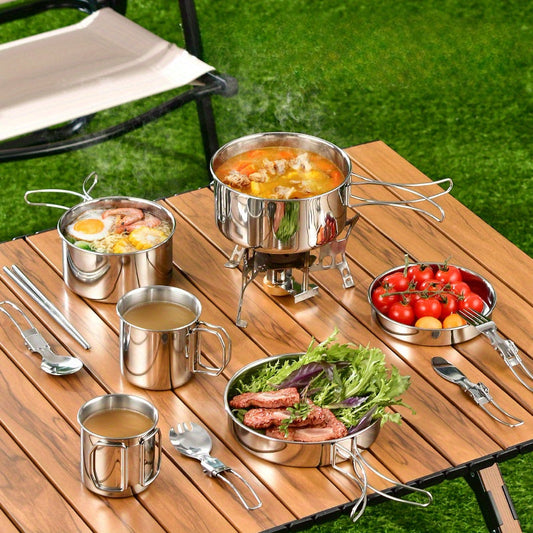 A complete set of 6 stainless steel outdoor cookware pieces for camping and picnics. This set includes a versatile multi-use board, 2 folding pots, a frying pan, and cups, all packed neatly in a storage bag. Rust-proof and portable for easy cooking