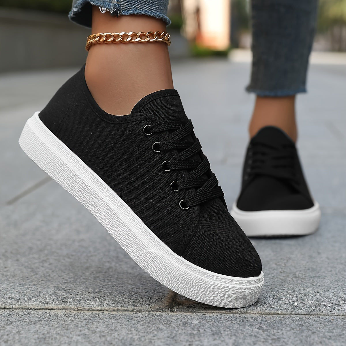 Women's platform skate sneakers with breathable fabric upper and durable PVC sole. Versatile casual shoes for walking and outdoor activities in black and white. Features comfort insole.