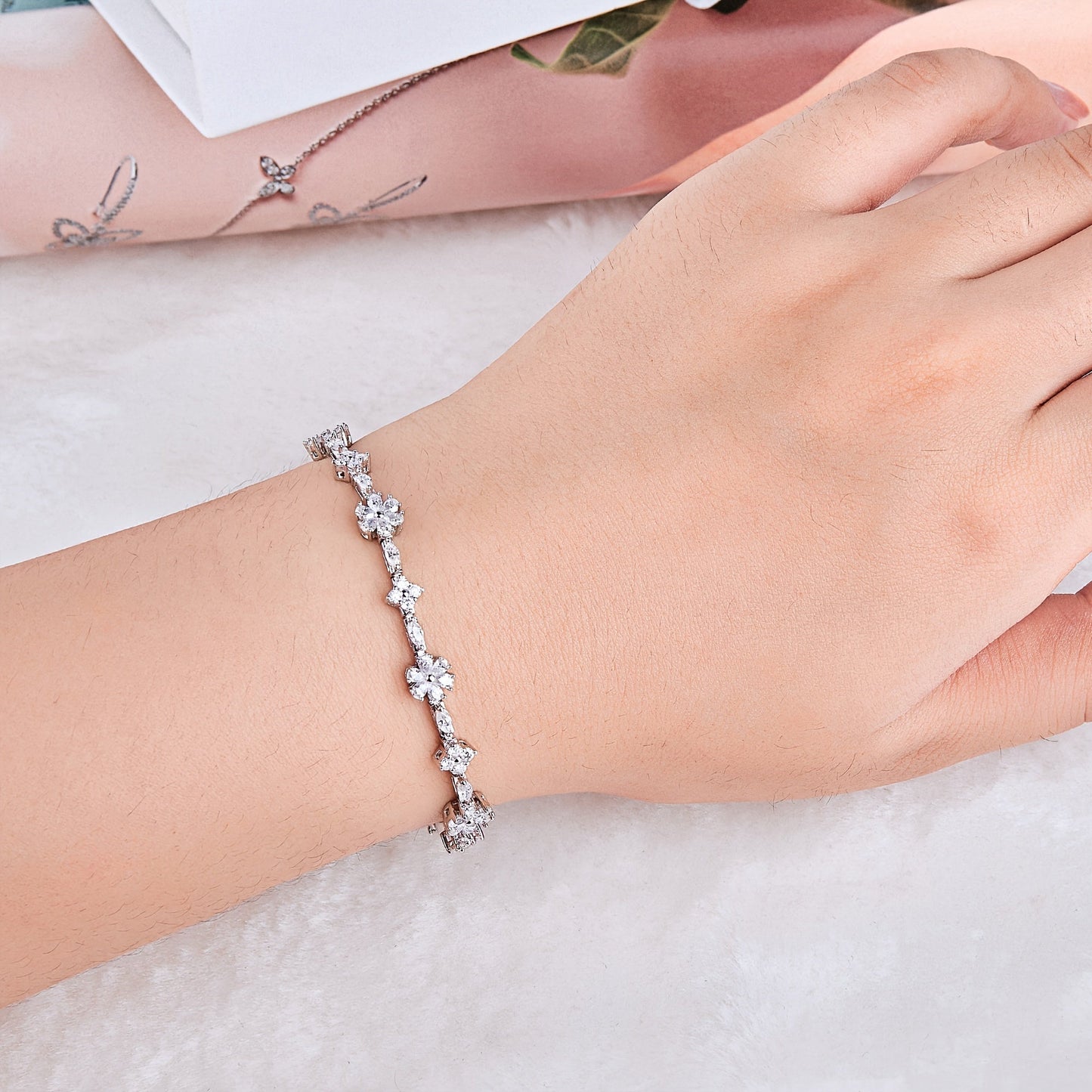 One elegant Onedia bracelet crafted from 925 sterling silver with sparkling synthetic moissanite stones. This stunning piece is adorned with a white golden plating and features the October birthstone. Perfect for gifting, parties, and special occasions