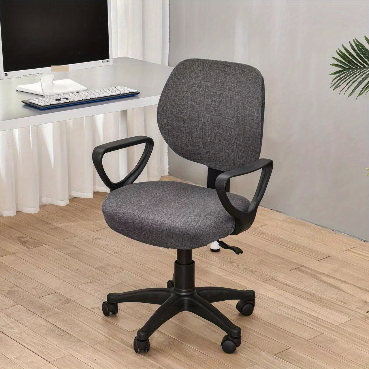 Elastic slipcover for computer dining chair, spandex material, washable and suitable for office or home decor.