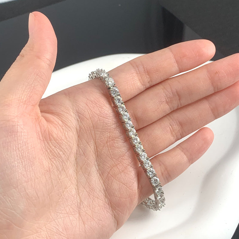 Get your hands on the elegant ConiiW Vintage Luxury Tennis Bracelet made from 925 Sterling Silver with Moissanite stones. This stunning piece is plated with 18K Gold and is a versatile unisex fashion accessory. It comes in a beautiful gift box, perfect