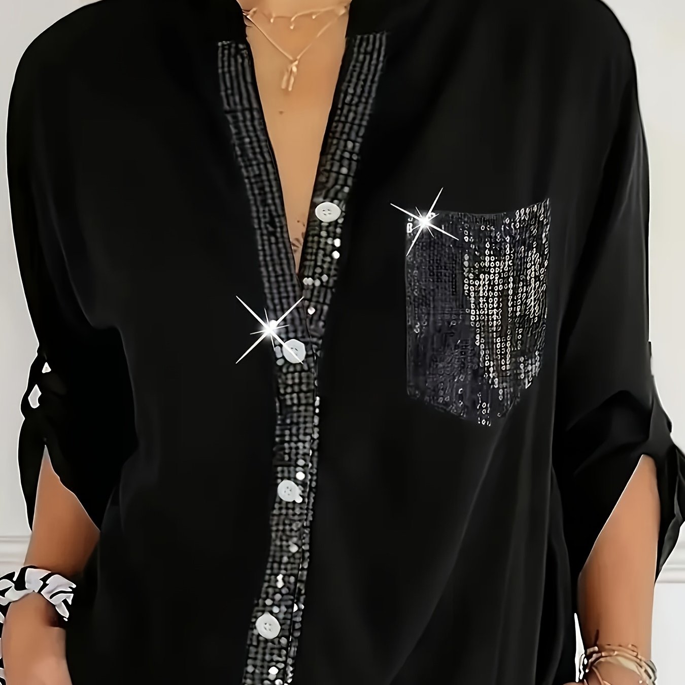 Casual loose V-neck shirt with sequin details, solid color, long sleeves, and an elegant irregular hem for women in spring and autumn.