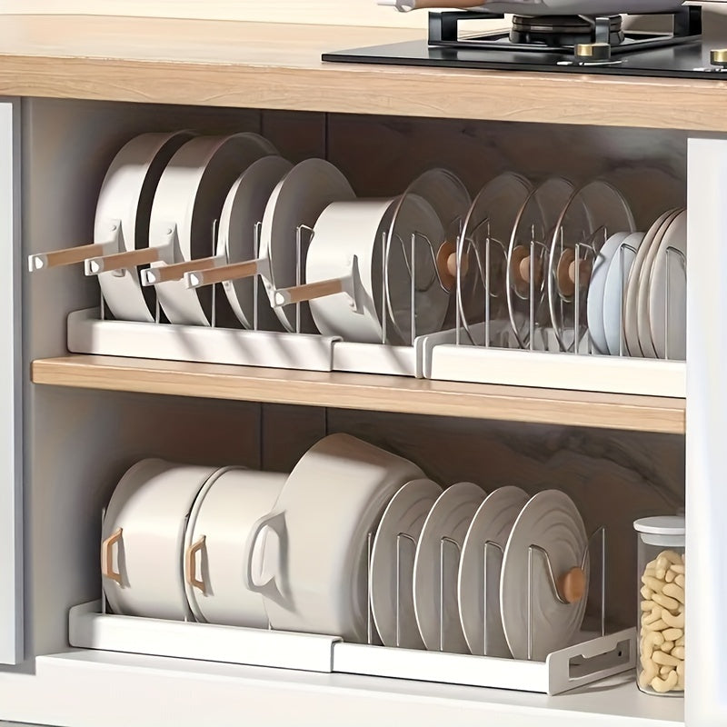 Retractable pot rack for kitchen storage, built into the cabinet under the sink. This adjustable rack is designed to store pots, pans, and lids, making it a convenient kitchen accessory.