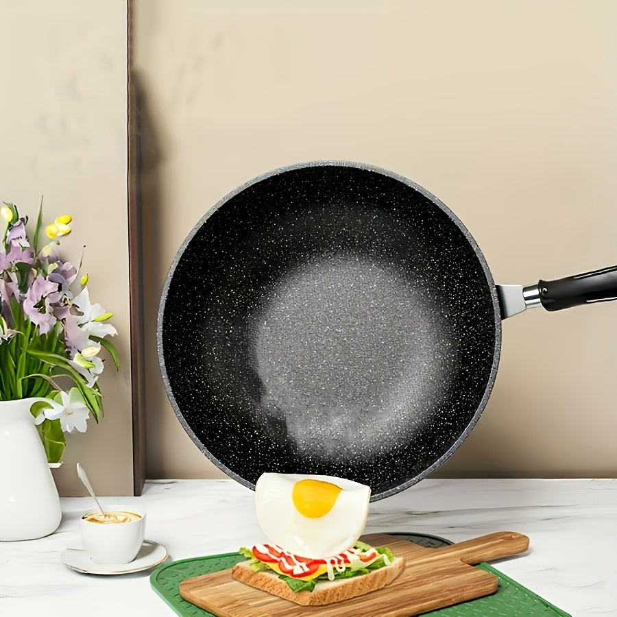 The Emerald Green Non-Stick Cast Iron Skillet comes with an optional Tempered Glass Lid. It is versatile for frying, stirring, and stewing and is compatible with all stovetops. This skillet is easy to clean and can be used on stone pots, outdoor BBQs