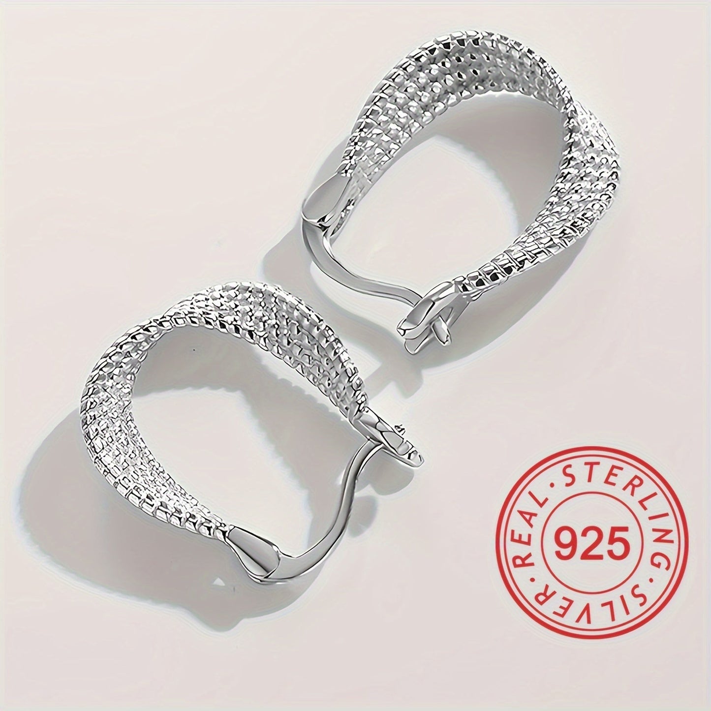 Classic and elegant, these twisted design hoop earrings are made of S925 sterling silver, making them hypoallergenic and perfect for sensitive ears. A timeless and exquisite gift for any woman.