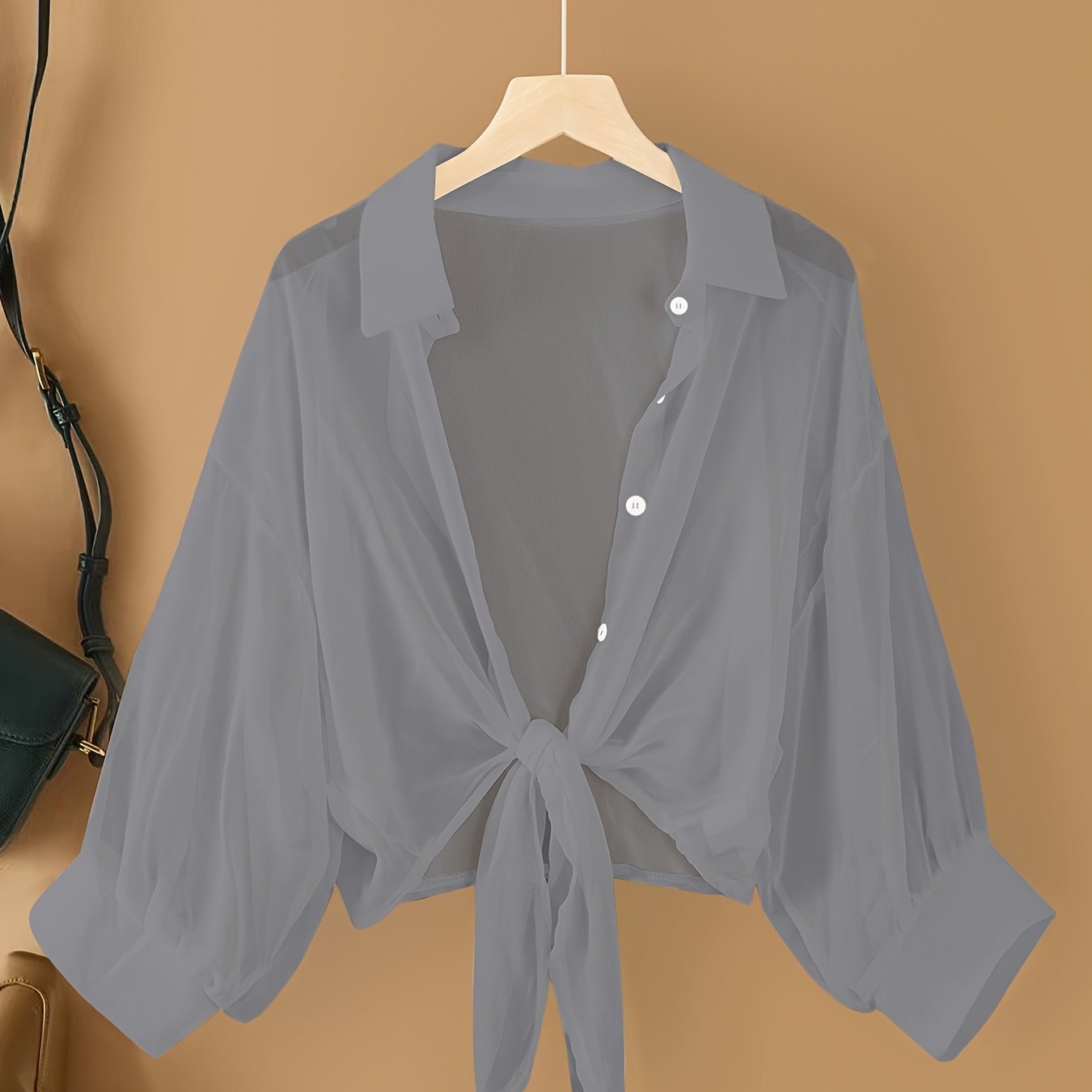 Women's casual chiffon cardigan with front bow detail and lapel collar, suitable for spring/summer/fall.