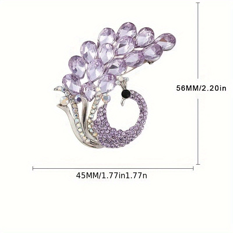 A beautiful purple crystal brooch pin, featuring an elegant and unique design with rhinestones. This fashion accessory is made from high-quality alloy material and showcases a stunning peacock design, perfect for women who appreciate stylish and