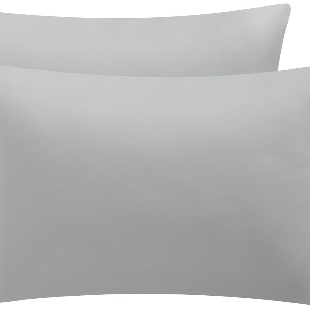 Water-resistant Grey Universal Pillow Protector Cover made from durable, stain-resistant 100% polyester fabric. Machine washable and suitable for home, hotel, or dorm use. Weighing 105gsm.