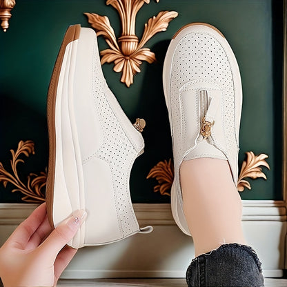 Beige perforated women's casual sneakers with zipper detail, thick sole, and anti-slip features.