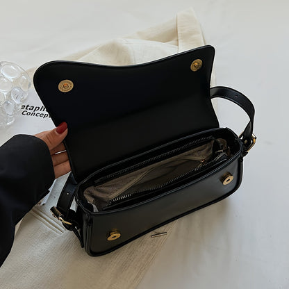 Stylish black crossbody bag with adjustable strap for casual and formal occasions.