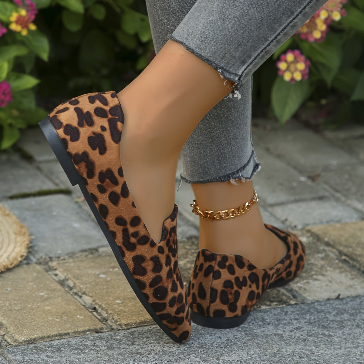 Leopard print slip-on flats with pointed toe and velvet upper.