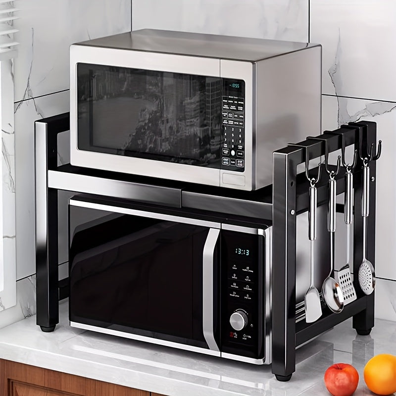 Black expandable microwave rack with 6 hooks for hanging spoons, an extendable stand for kitchen utensils, and storage for rice cookers and toasters. Width ranges from 37cm to 61cm.