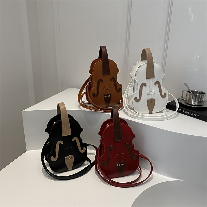 Stylish black/white violin-shaped crossbody bag with adjustable strap, perfect for casual use.