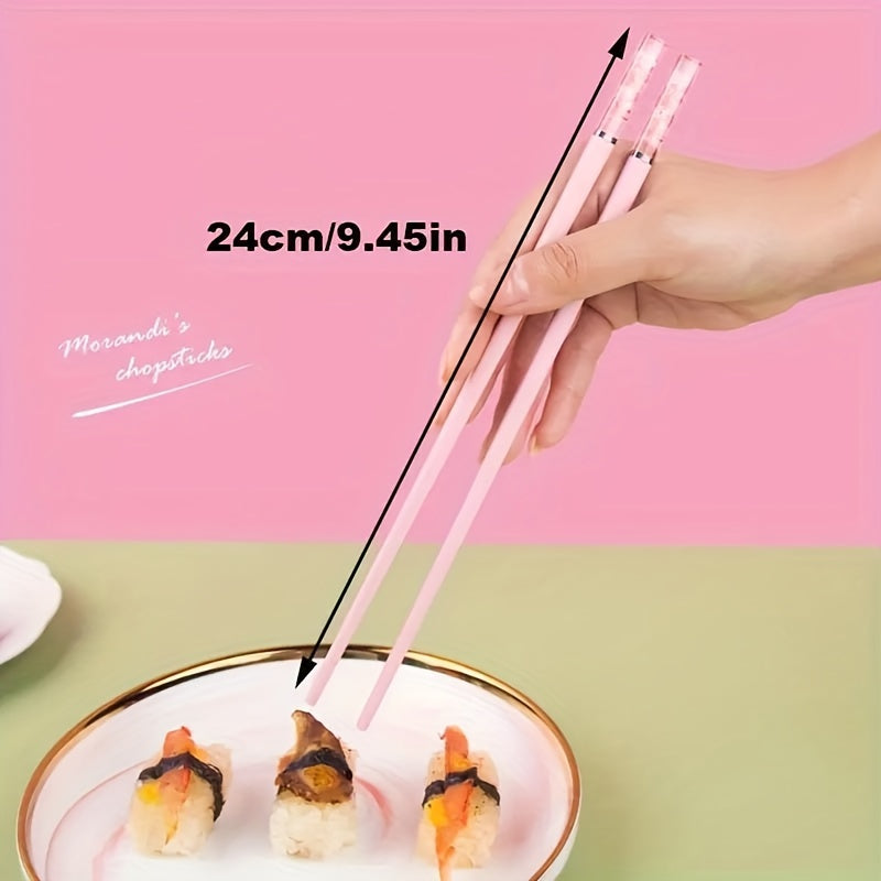 One set of Pink Cherry Flower Amber Chopsticks, ideal for Chinese and Korean style meals such as fast food, sushi, and ramen. Perfect for family meals and reusable kitchen supplies.