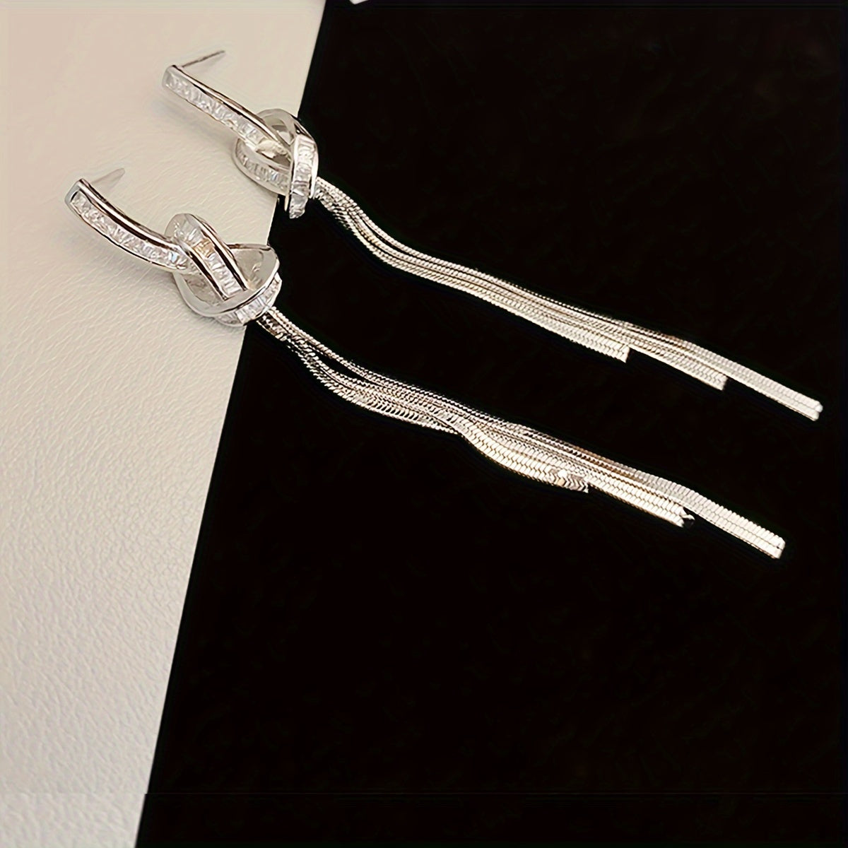 New for 2024, these unique sterling silver needle earrings feature long tassels for a light luxury look that is sure to elevate any outfit.