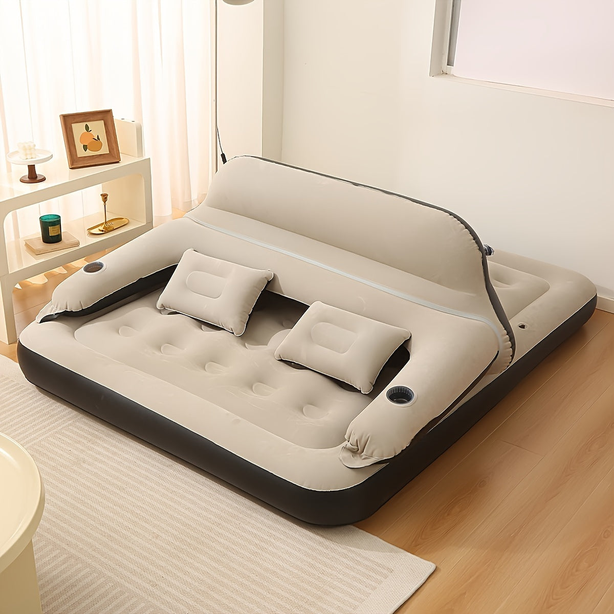 Air mattress with headboard, blow-up sofa bed, for indoor and outdoor use.