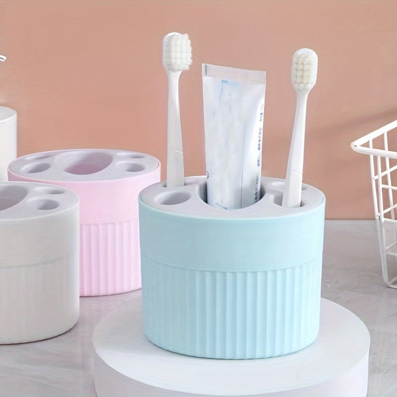 Toothbrush and toothpaste storage rack with detachable shelf for bathroom organization, easy to clean and convenient for makeup brush storage.