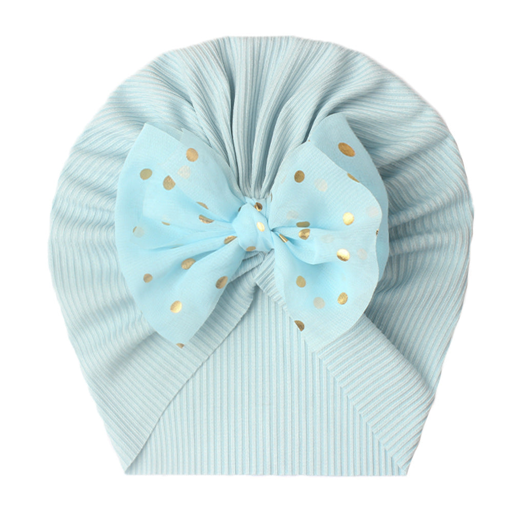 Polka dot printed bow head wrap for newborn infants and toddlers.