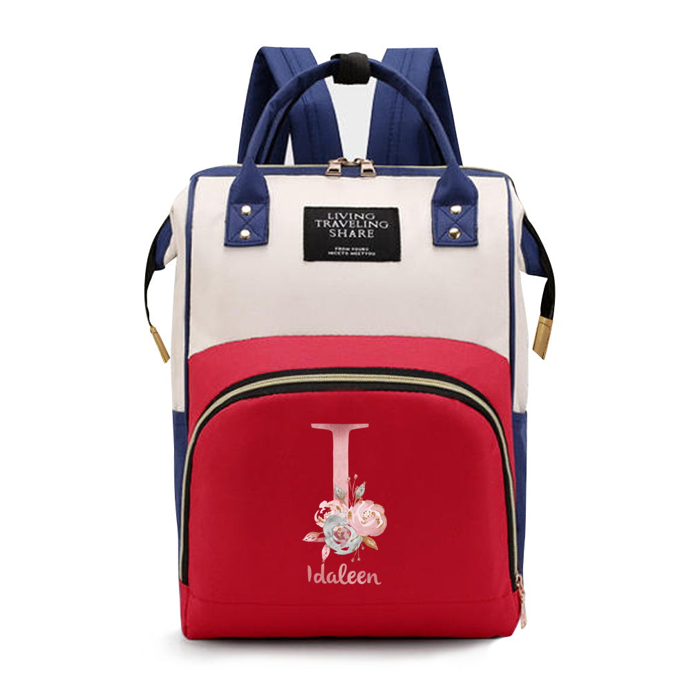 Personalized Mommy Backpack made of durable Oxford cloth with ample storage space for diapers and other essentials. Features customizable initials and name, as well as convenient bottle pockets. Perfect for nursing mothers on-the-go, with options for A-Z