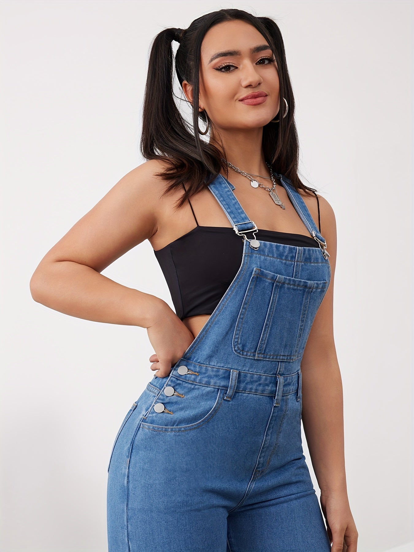 Women's adjustable denim overalls with wide-leg jeans, button detail, and machine washable.