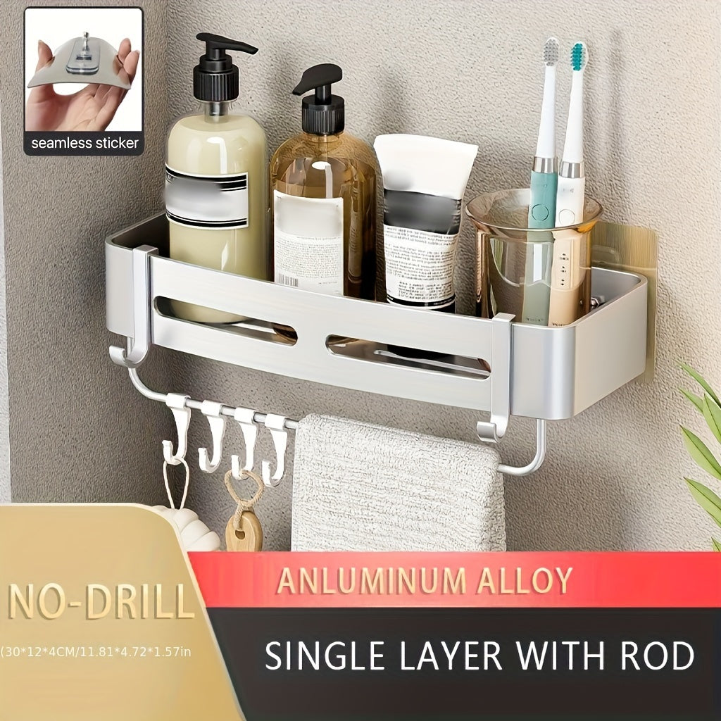 Wall-mounted bathroom storage rack for shampoo, shower gel, and cosmetics; made of space aluminum with no need for drilling.