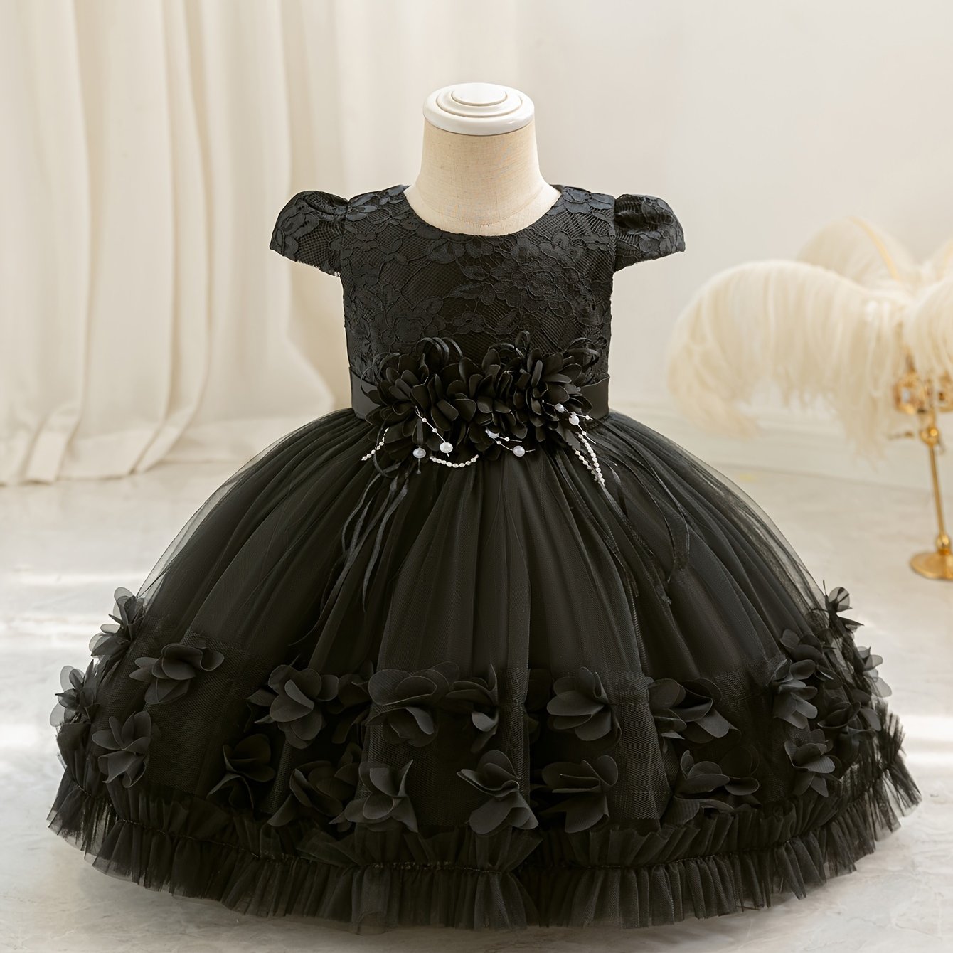 Baby's floral tulle princess dress with lace sleeves for formal occasions.