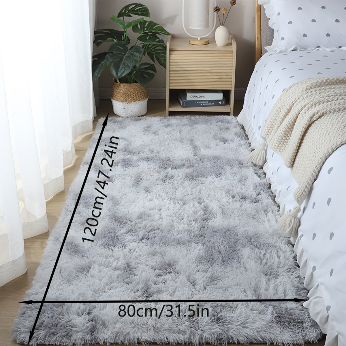 One piece of plush, fluffy area rug designed for bedrooms. This soft, fuzzy shaggy rug is black in color and rectangular in shape, perfect for adding warmth to your living room. It features a non-slip bottom to ensure safety. Great for Halloween or