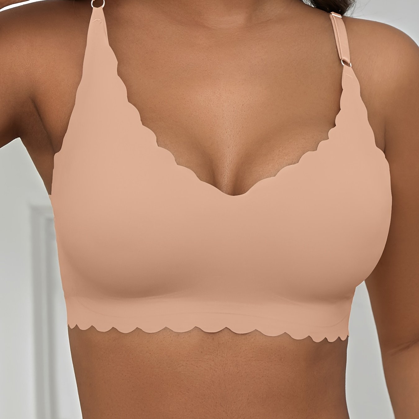 Seamless wireless bra for plus-size women with high elasticity and removable padding, in v-neck solid color.