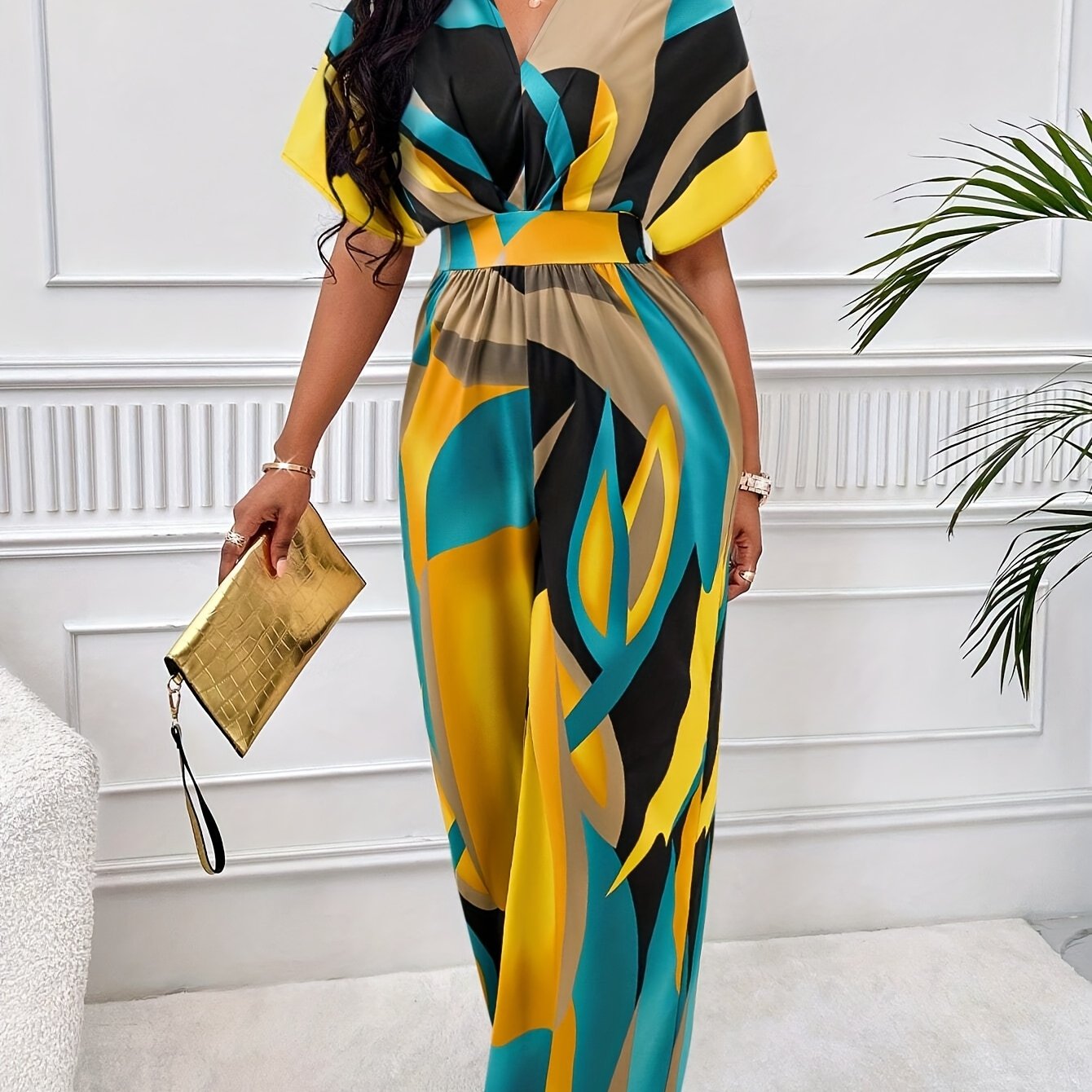 Women's geometric print jumpsuit with batwing sleeves, tie waist, v-neck, machine washable polyester, suitable for all seasons.