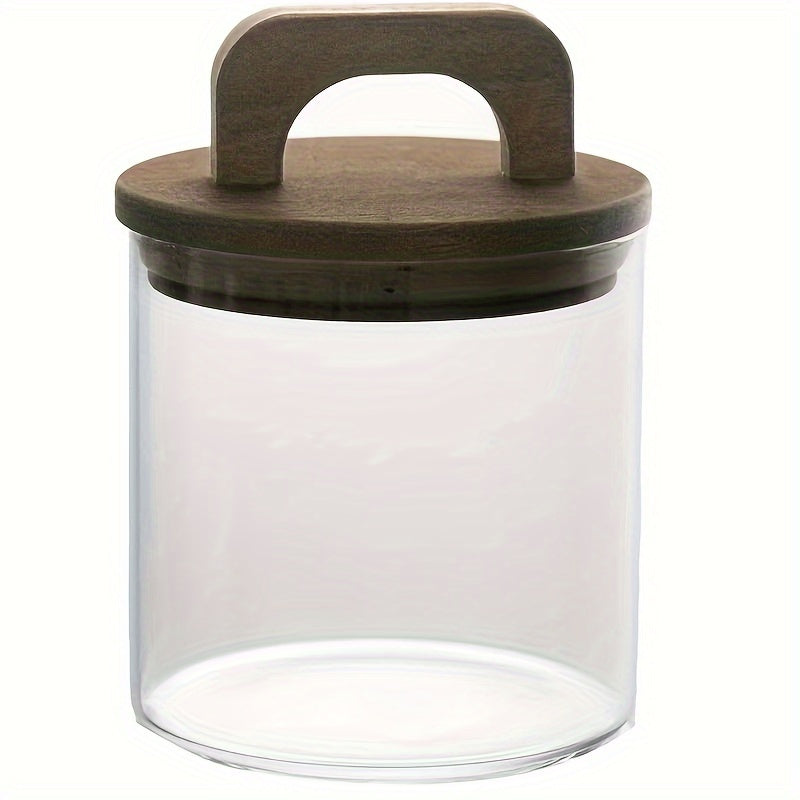 Glass storage jar with a wooden lid and a capacity of 27oz/800mL. This multi-purpose jar is freezer safe and should be hand washed only. Perfect for storing coffee, tea, or food.