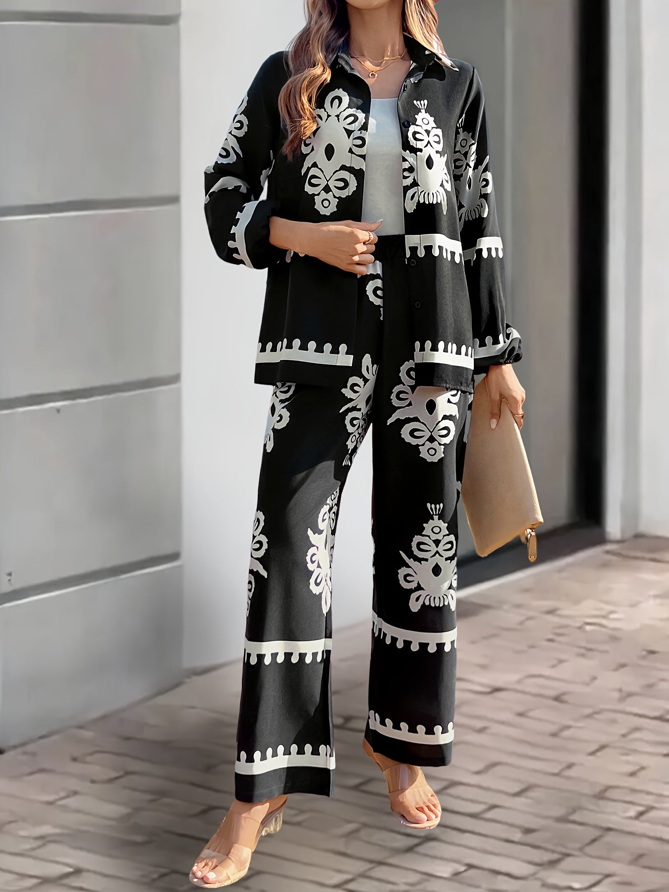 Women's 2-piece casual suit made of 100% polyester, featuring a long sleeve top with button front and pants with plant pattern. Loose fit with cardigan collar and regular sleeves, suitable