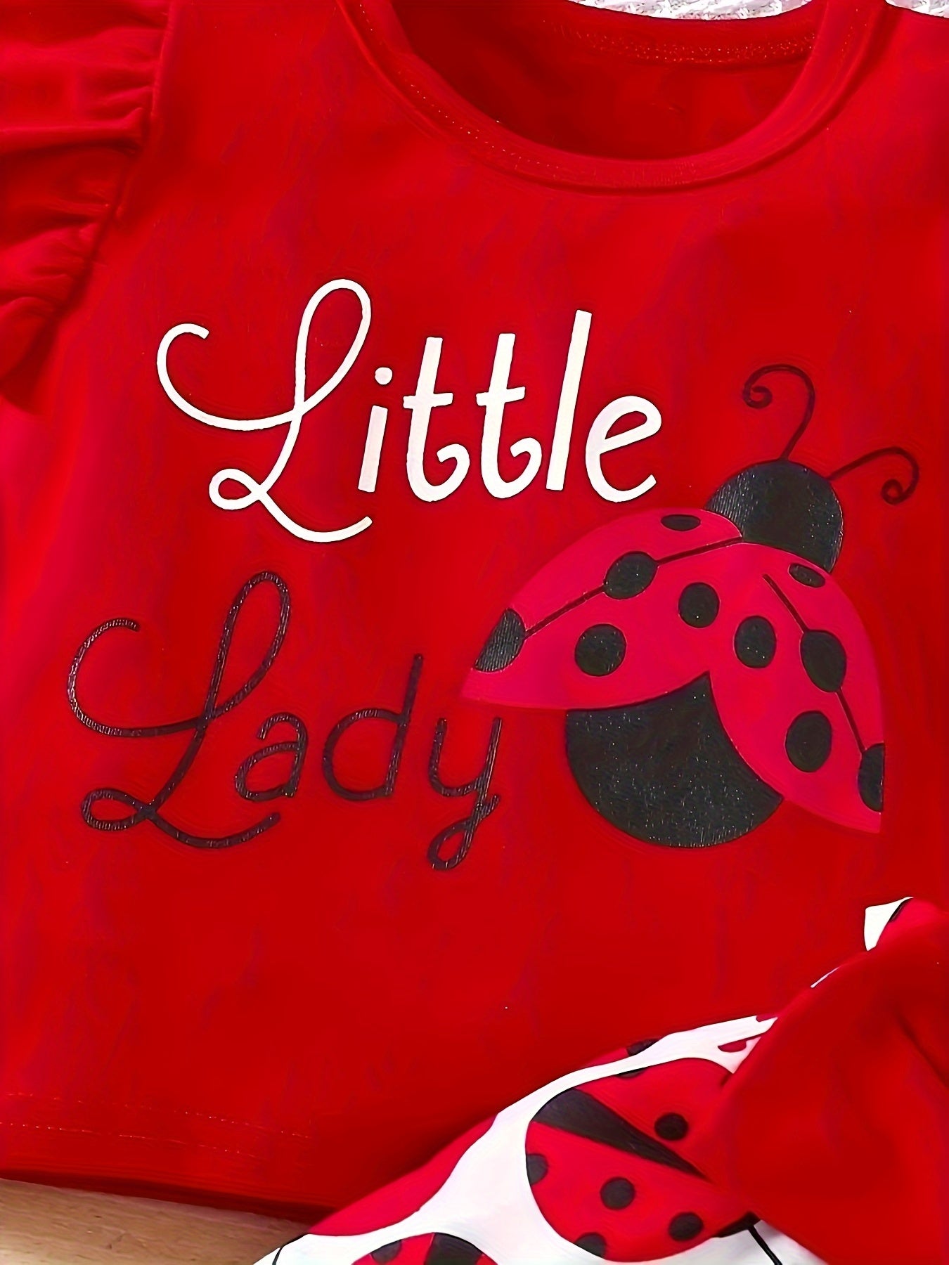 Adorable ruffled sleeve t-shirt and bow/ladybug shorts set for baby girls, ideal for casual outdoor wear this season.