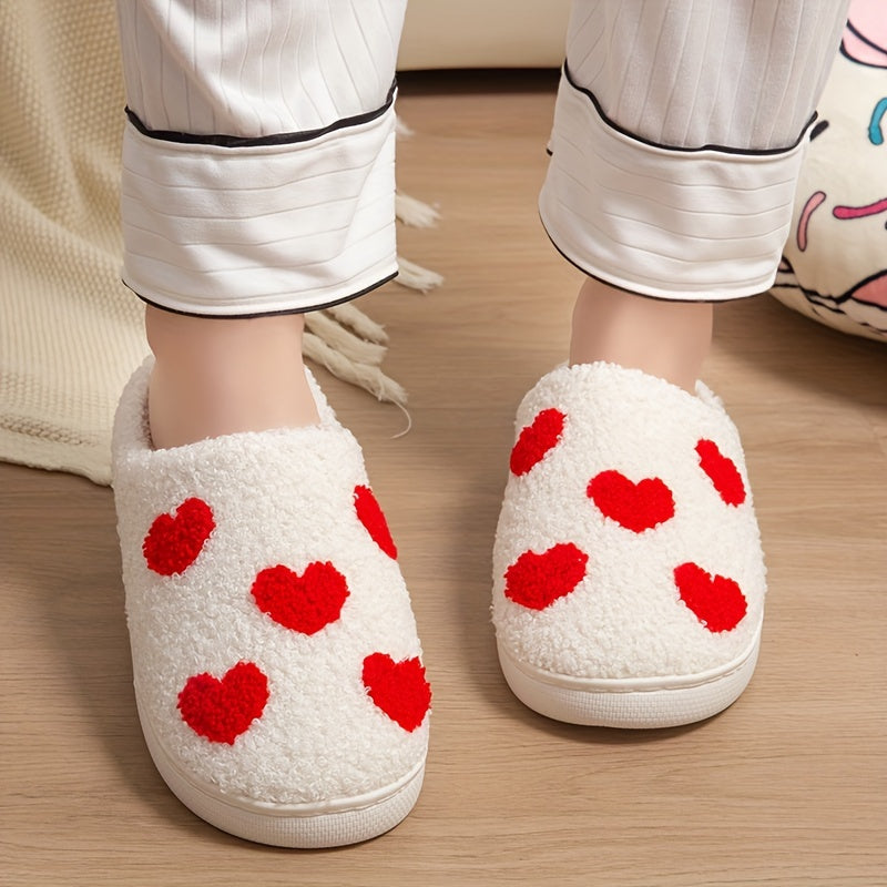 Cozy slip-on slippers with cute heart pattern, plush lining for indoor comfort.