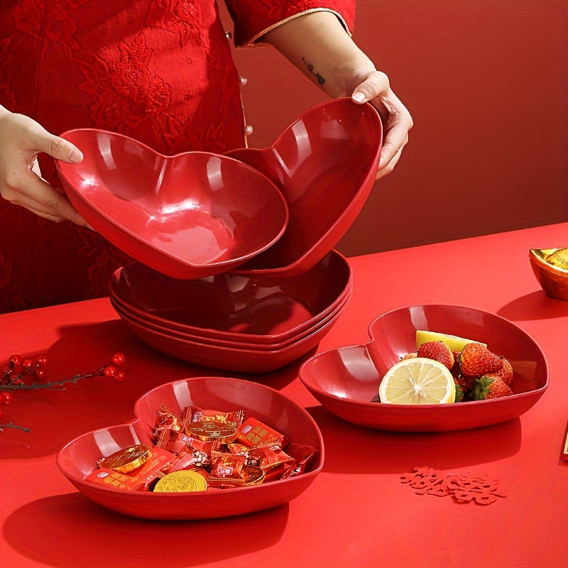 Heart-shaped plastic plates for weddings in sets of 4 or 8. Decorative red serving dishes for snacks, salads, and candy. Versatile party platters for all seasons.