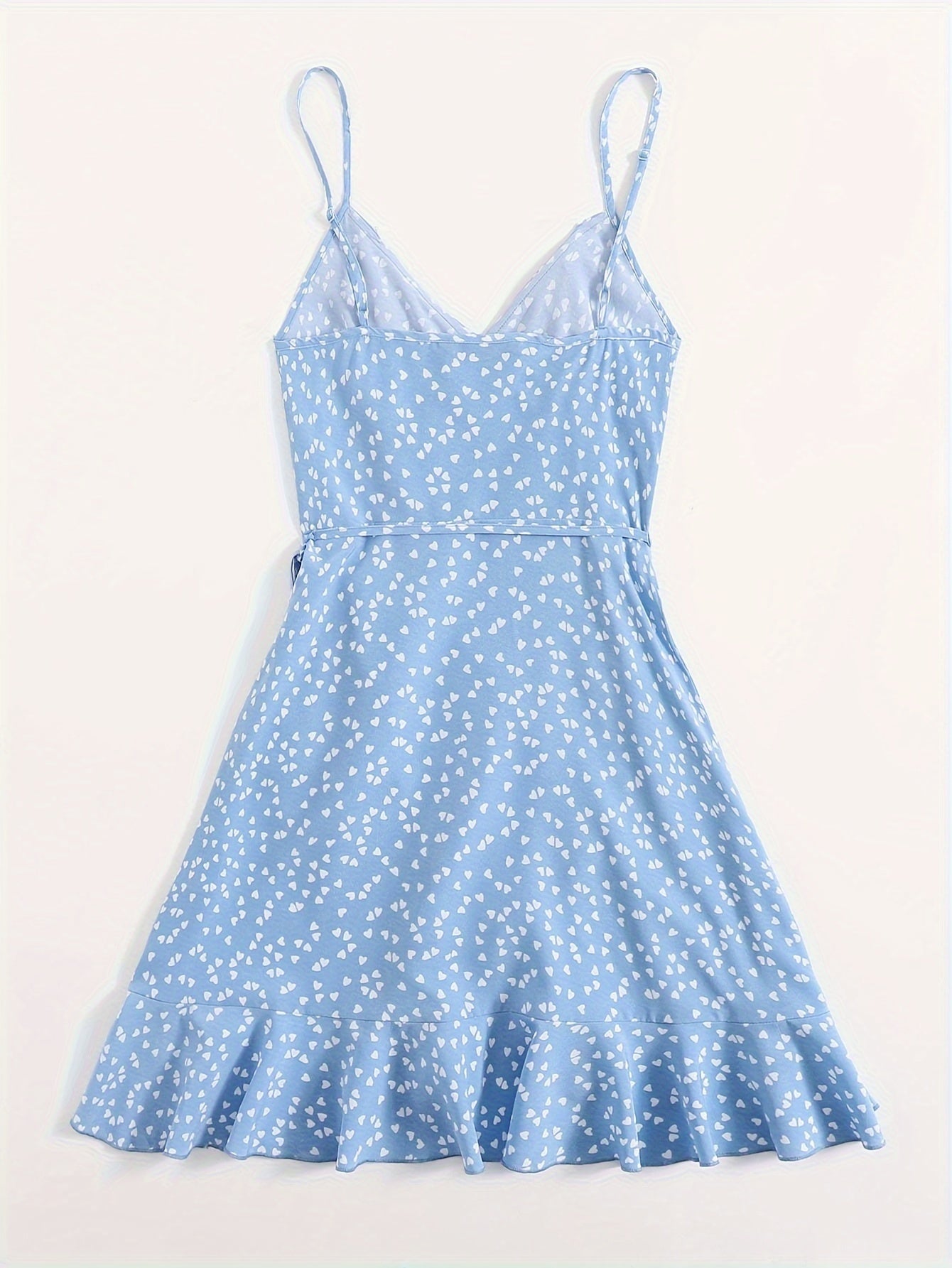 Heart print ruffle cami dress with lace-up detail, sleeveless V-neck design, perfect for spring and summer.