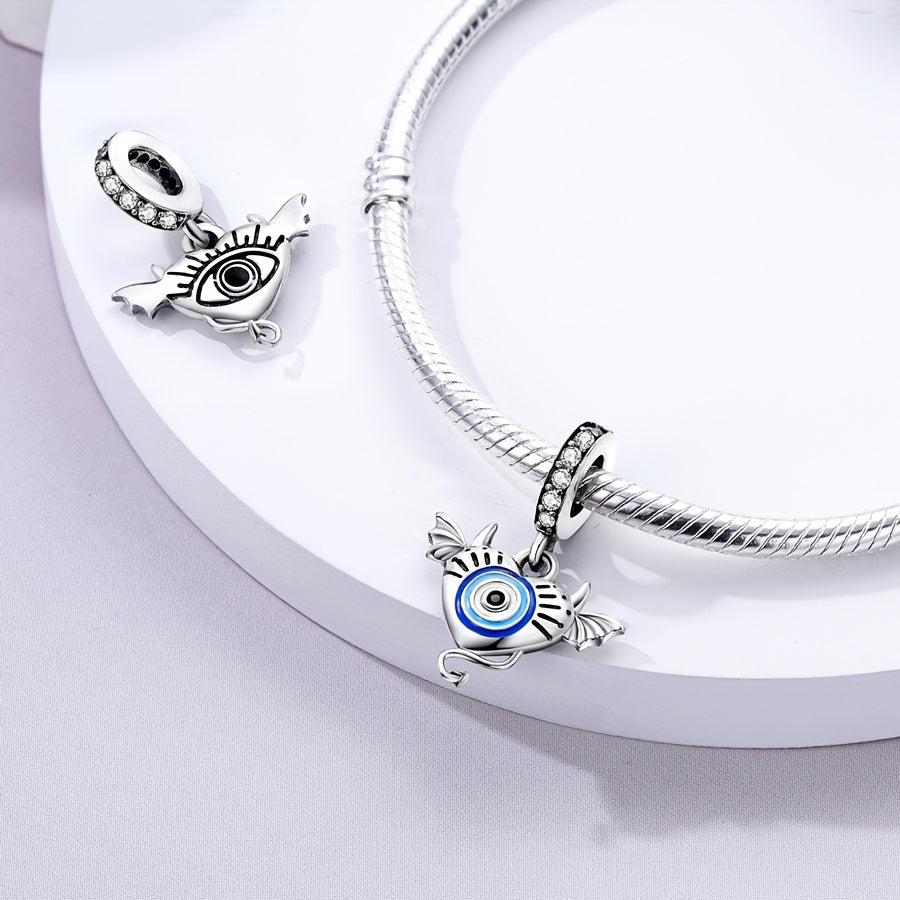 Silver-plated devil pendant with blue eyes, suitable for bracelets and necklaces. Made with cubic zirconia, perfect for DIY jewelry making or gifting. Featuring a unique and original design, this simple yet fashionable piece is ideal for women's birthday