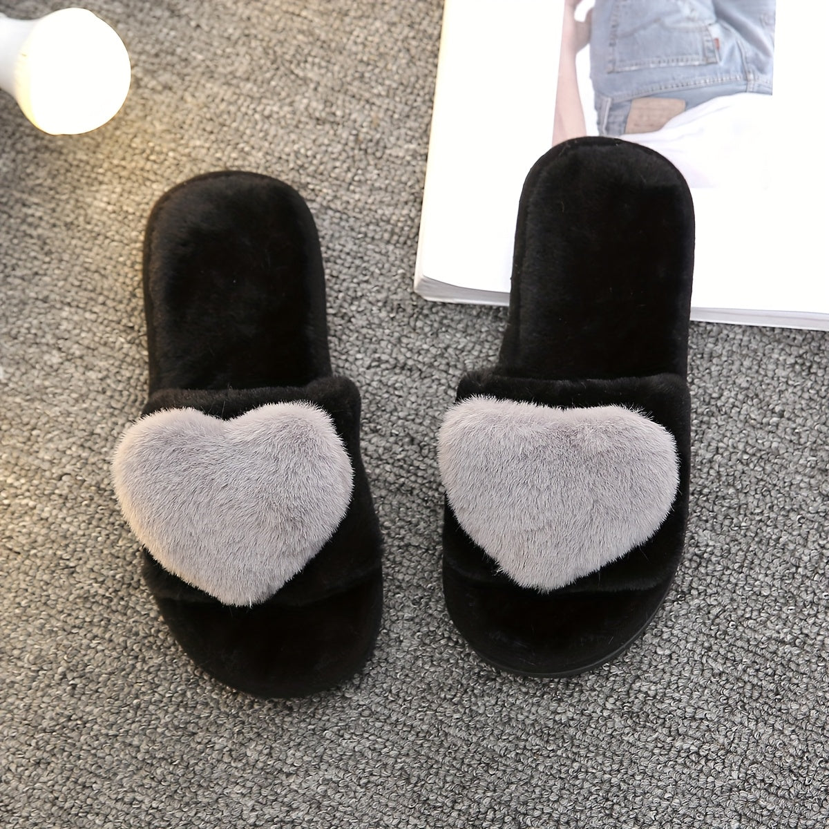 Warm and cozy women's plush slippers with heart accent for indoor comfort and style.