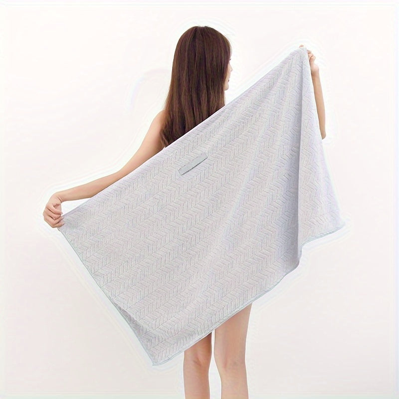 Fast-drying microfiber hair towel for women with long, thick, and curly hair. Soft coral fleece material with elastic band for everyday comfort. Beige textured design for quick drying.