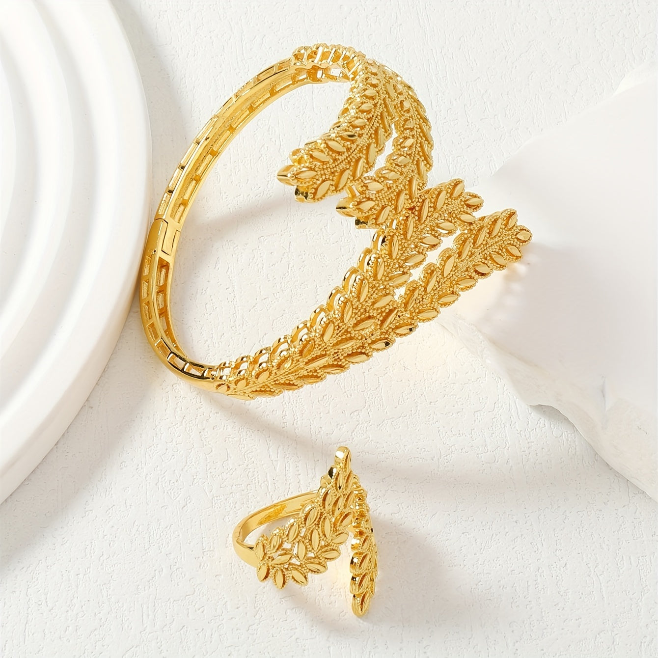 Vintage jewelry set featuring a bangle and ring plated in 22k gold with a stunning golden wheat design, symbolizing fortune and luck. Perfect for everyday wear or as an elegant addition to your party outfits. Complete your ensemble with this exquisite