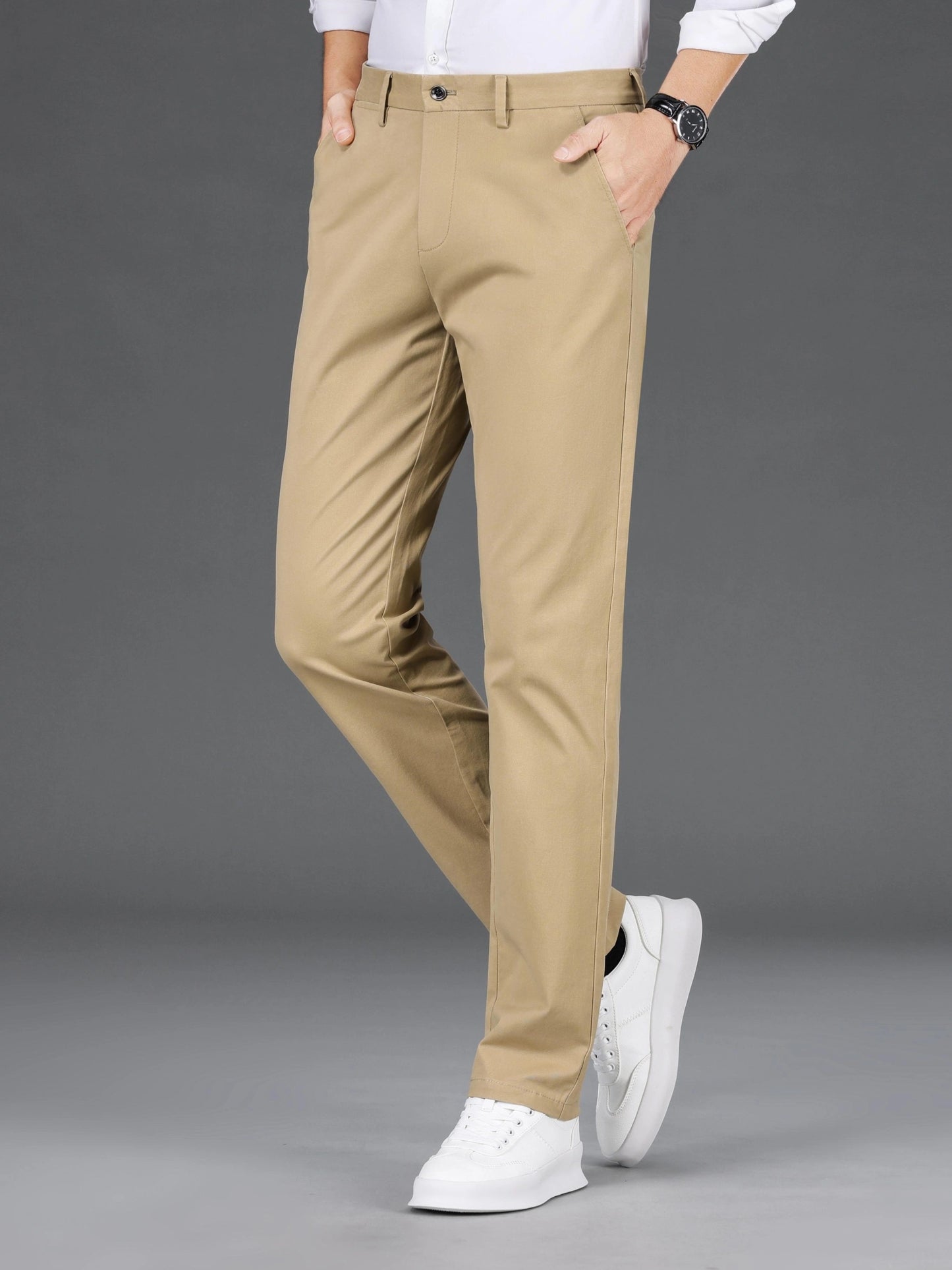 Men's slim-fit cotton blend trousers in solid color, suitable for business casual wear throughout the year. Features micro-elastic fabric, pockets, and regular length.