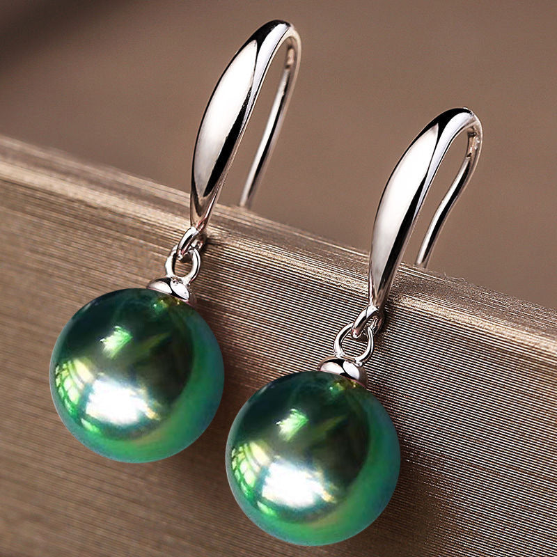 Give the gift of elegance with these stunning S925 Sterling Silver earrings featuring large natural green pearls measuring 12mm. Perfect for your daughter, girlfriend, wife, mother, or friends, these earrings are ideal for any occasion, from parties and