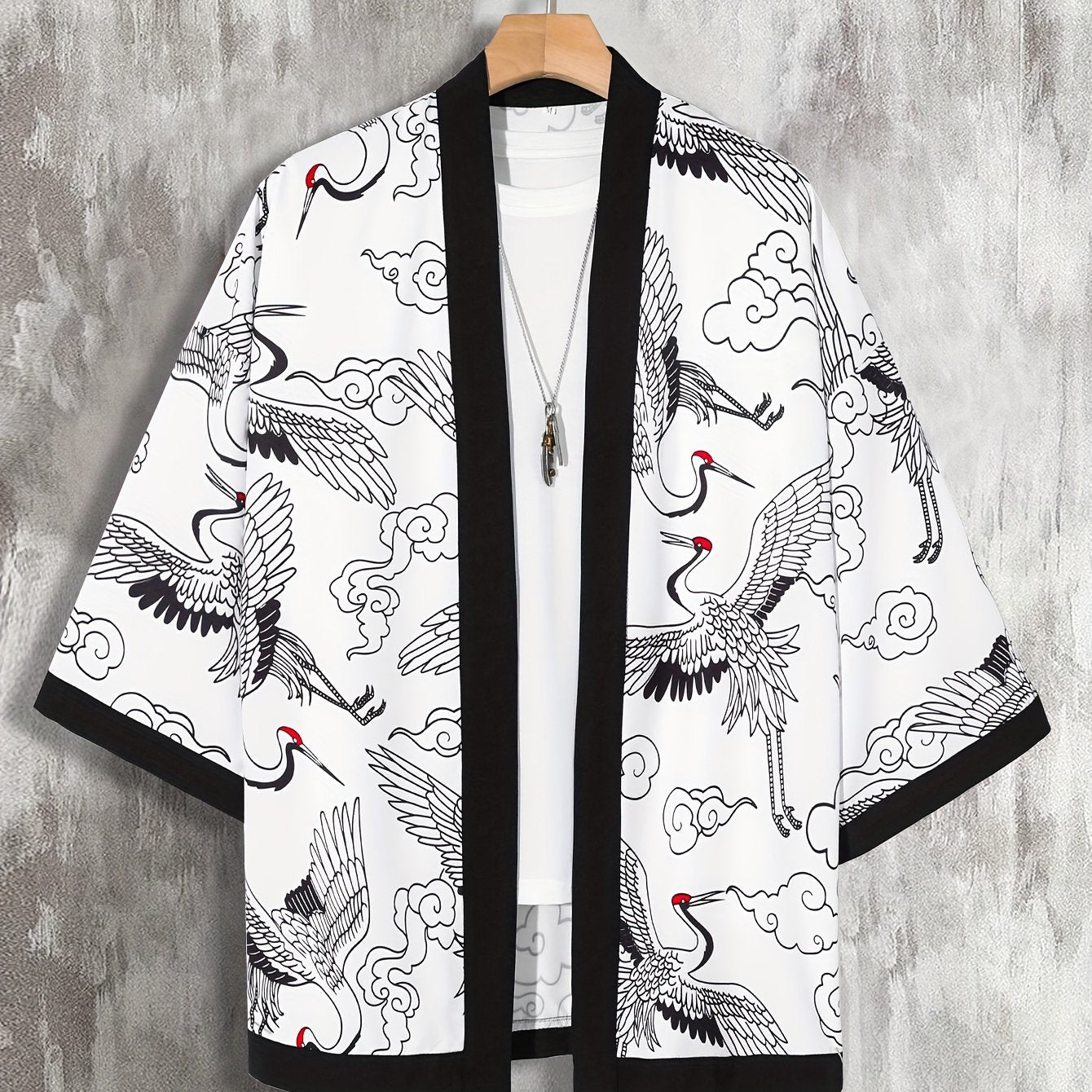 Men's loose-fitting kimono-style shirt with paisley and Japanese letter print, perfect for summer vacation photos at the resort.