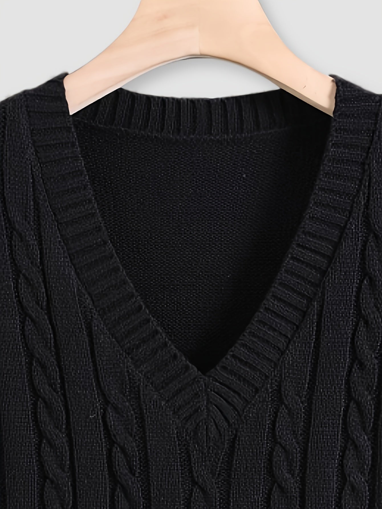 Men's lightweight black cable knit sweater vest is a casual V-neck, sleeveless pullover made from acrylic fabric, suitable for spring/autumn. Also available in plus size.