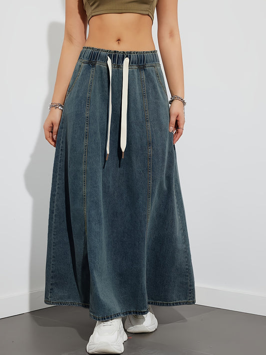 Casual style denim maxi skirt with drawstring waistband in washed blue.