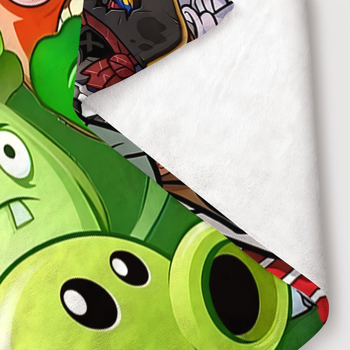 Stay cozy with this Plants vs Zombies printed fleece throw blanket, featuring a contemporary design in mixed colors. Made from knitted fabric, this machine washable blanket is perfect for all seasons. The digital print adds a fun touch, making it a great